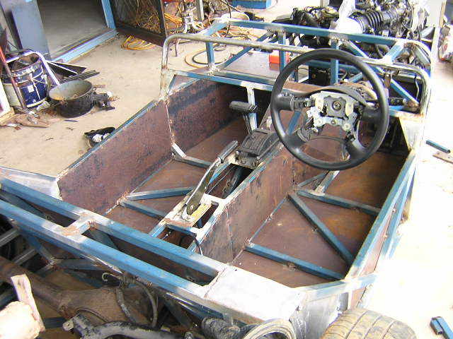 here in Australia we are required to provine intrusion protection so cockpit is lined with steel for extra rigidity my scuttle is welded to the chassis , which is 50 mm wider than the book to match the Toyota Lite Ace running gear.